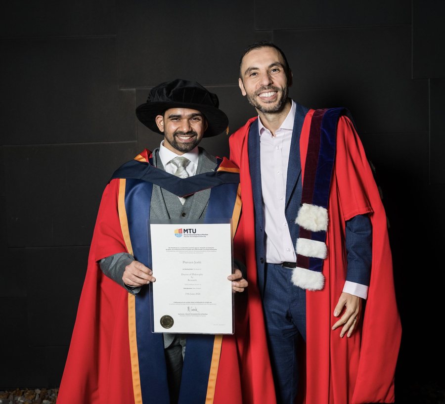 Dr Praveen Joshi at his doctoral graduation with Dr Haithem Afli.